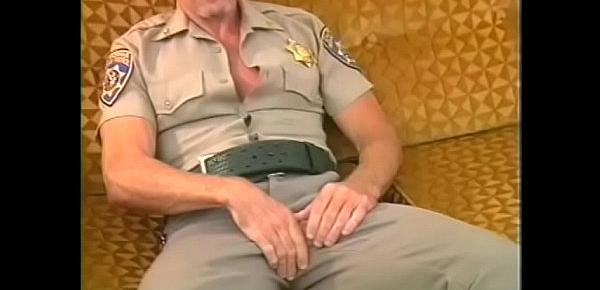  Muscular bear in leather chaps gets his cock slurped by police